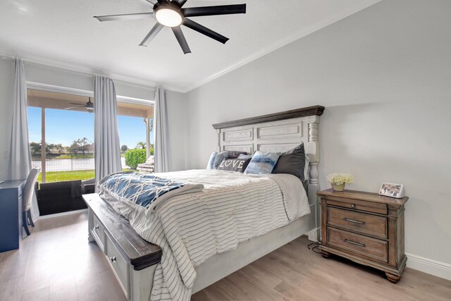 bedroom with light wood-type flooring, ceiling fan, and crown molding