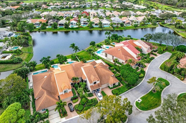 birds eye view of property featuring a water view