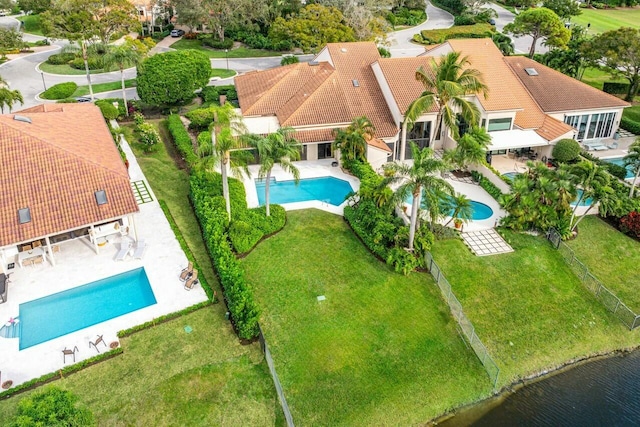 birds eye view of property featuring a water view