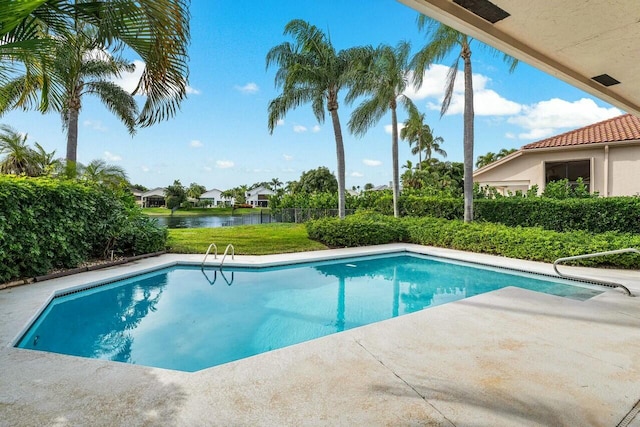 view of pool with a water view