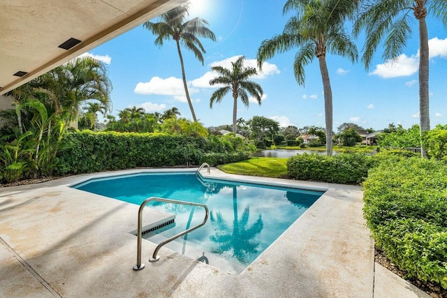 view of pool with a water view