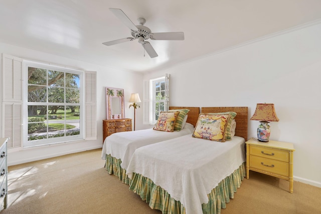 bedroom featuring light carpet and ceiling fan