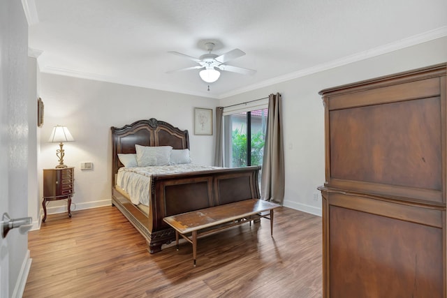 bedroom with wood-type flooring, ceiling fan, and ornamental molding