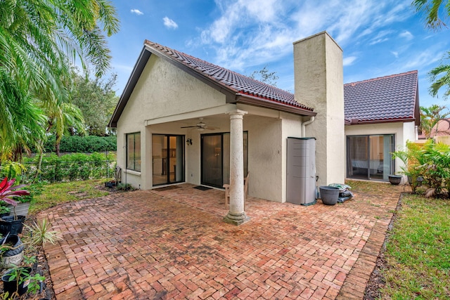 rear view of house with a patio and ceiling fan