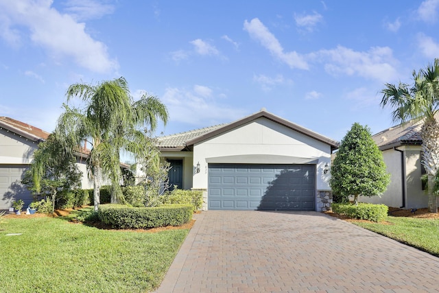 single story home with a front yard and a garage