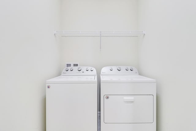 laundry room with washing machine and dryer