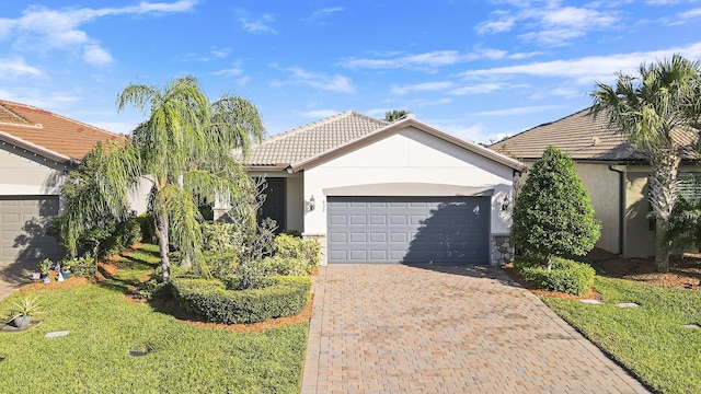 single story home with a front yard and a garage