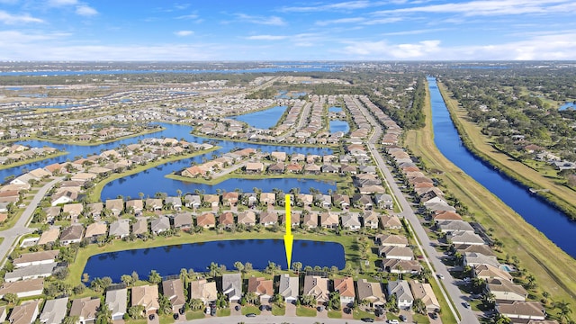 birds eye view of property featuring a water view