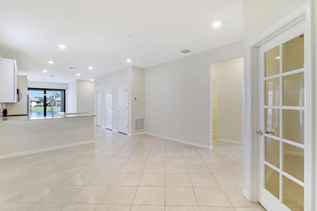 spare room with light tile patterned floors