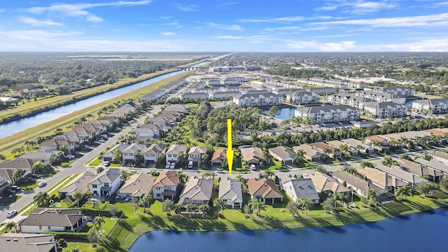 birds eye view of property featuring a water view