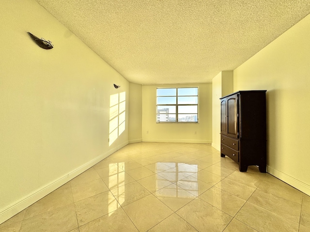 empty room featuring a textured ceiling