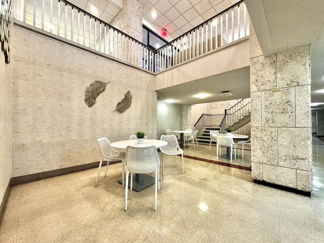 dining room featuring a high ceiling