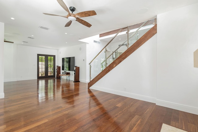 living room with ceiling fan, dark hardwood / wood-style flooring, and french doors