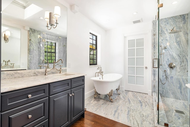 bathroom featuring vanity, separate shower and tub, and wood-type flooring