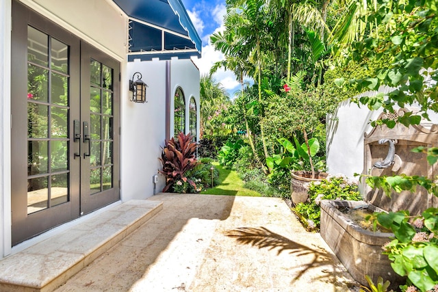 doorway to property featuring a patio area and french doors