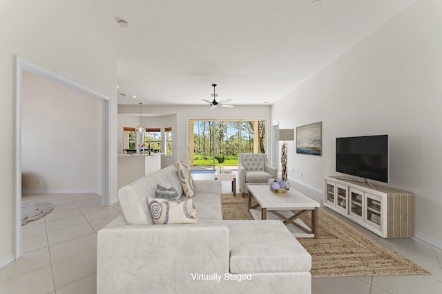 living room with ceiling fan and light tile patterned floors