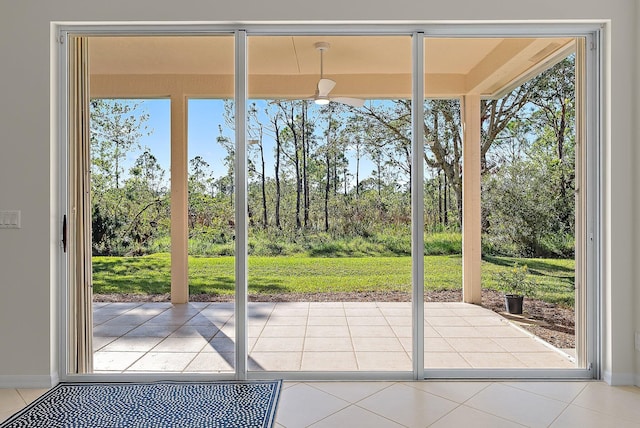 doorway to outside featuring tile patterned floors