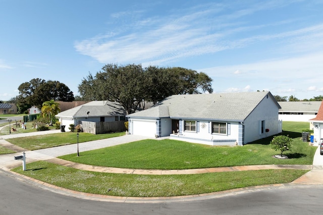 view of front of house featuring a front yard and a garage