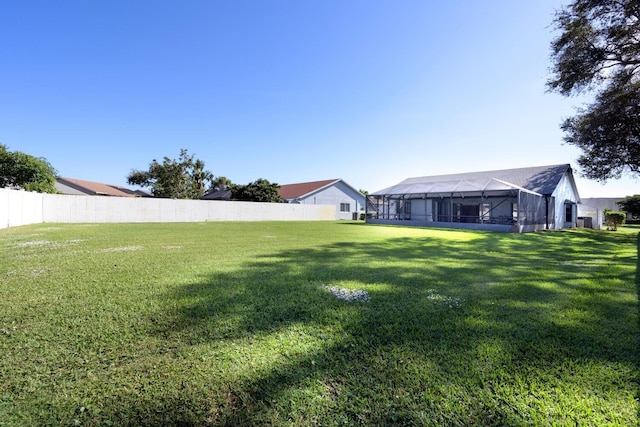 view of yard featuring a lanai