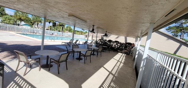 view of patio featuring a community pool