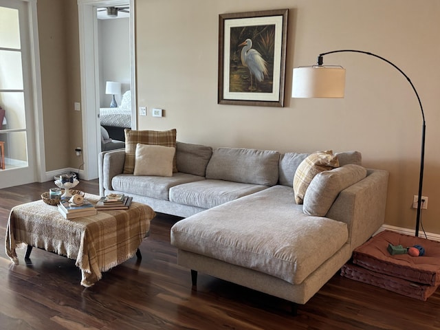 living room with dark hardwood / wood-style flooring