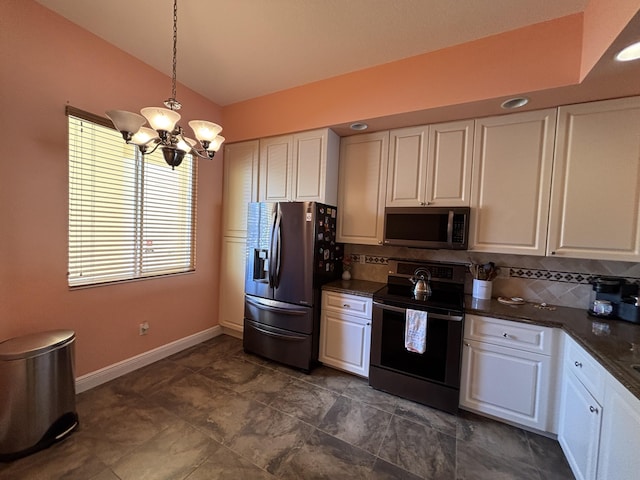 kitchen featuring appliances with stainless steel finishes, white cabinetry, hanging light fixtures, an inviting chandelier, and decorative backsplash