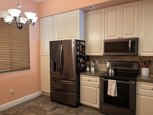 kitchen with white cabinetry, an inviting chandelier, tasteful backsplash, pendant lighting, and stainless steel appliances