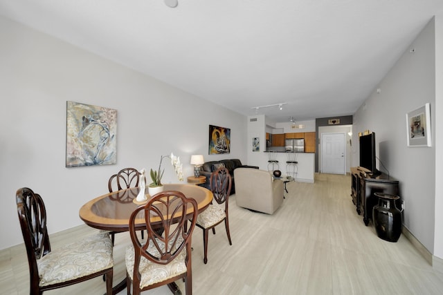 dining room with track lighting