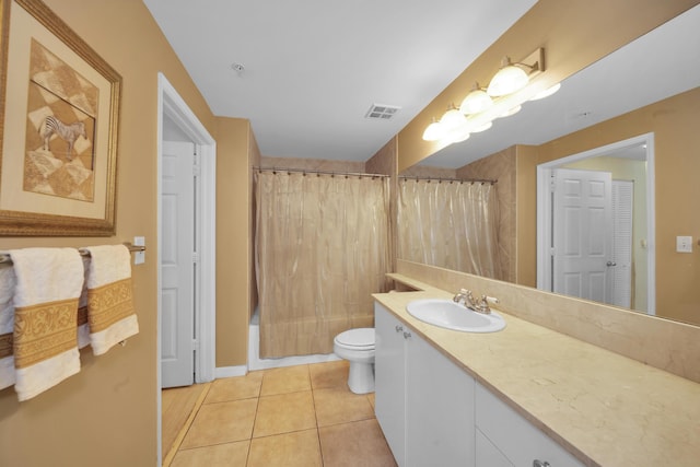 full bathroom featuring tile patterned floors, vanity, toilet, and shower / tub combo with curtain