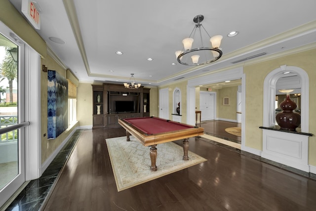 playroom featuring a raised ceiling, ornamental molding, dark hardwood / wood-style floors, and pool table