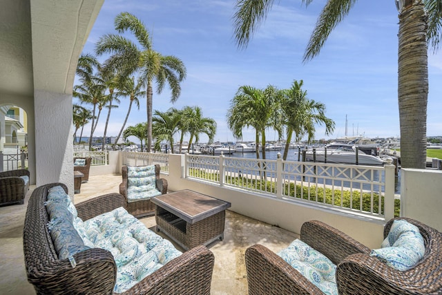 view of patio with a water view