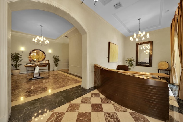 reception area featuring an inviting chandelier