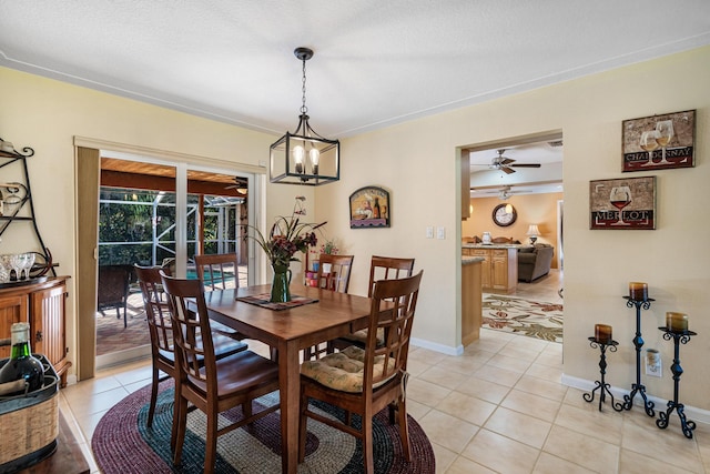 tiled dining area with ceiling fan