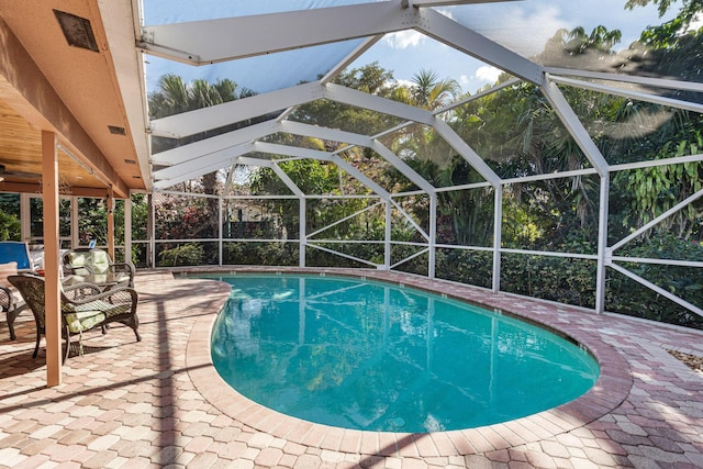 view of pool featuring a lanai and a patio area