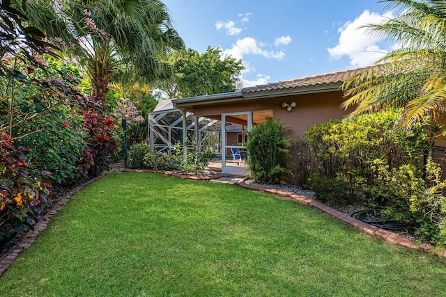 view of yard featuring a lanai