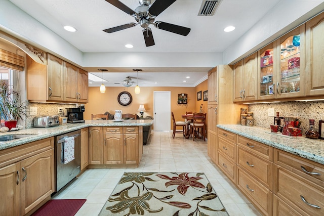 kitchen with light stone counters, light tile patterned floors, dishwasher, kitchen peninsula, and pendant lighting