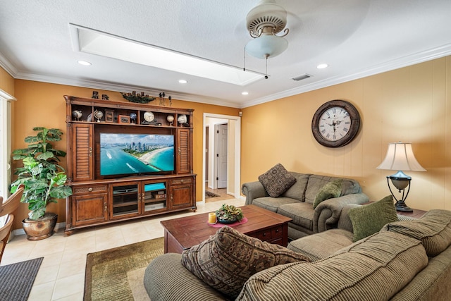 tiled living room featuring a skylight and ornamental molding