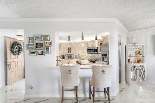 kitchen featuring kitchen peninsula, pendant lighting, a textured ceiling, decorative backsplash, and appliances with stainless steel finishes