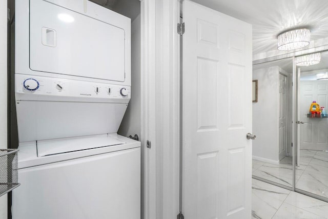 laundry room with stacked washer and dryer