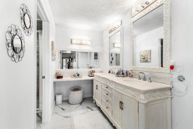 bathroom with vanity and a textured ceiling