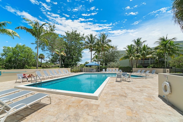 view of swimming pool with a patio area