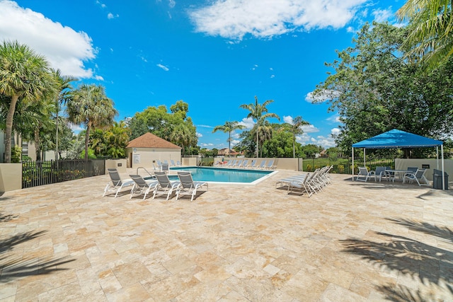 view of swimming pool with a patio