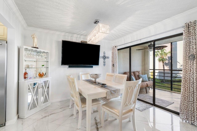 dining area with ceiling fan, crown molding, and a textured ceiling