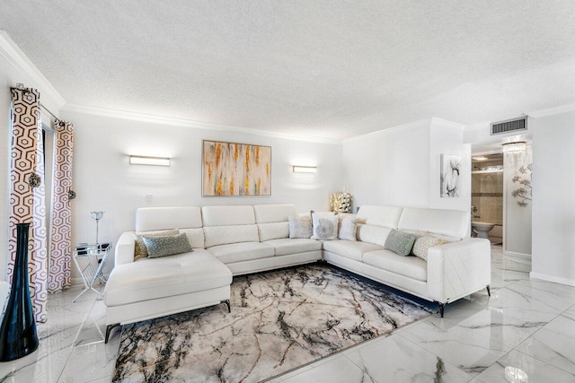 living room with a textured ceiling and crown molding