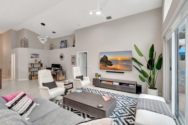 living room with ceiling fan, light tile patterned floors, and high vaulted ceiling