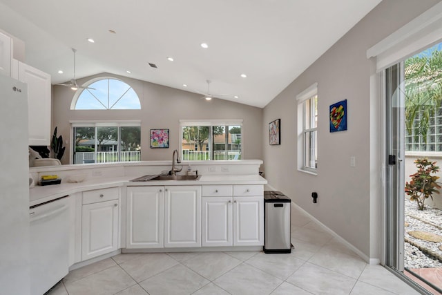 kitchen with dishwasher, white cabinets, a healthy amount of sunlight, and sink