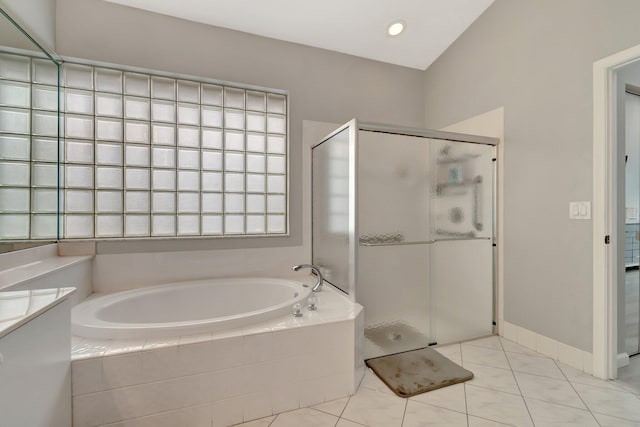 bathroom featuring tile patterned floors and shower with separate bathtub