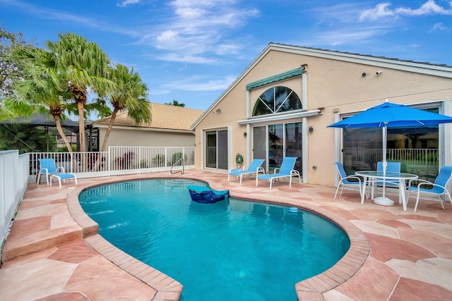 view of swimming pool featuring a patio area