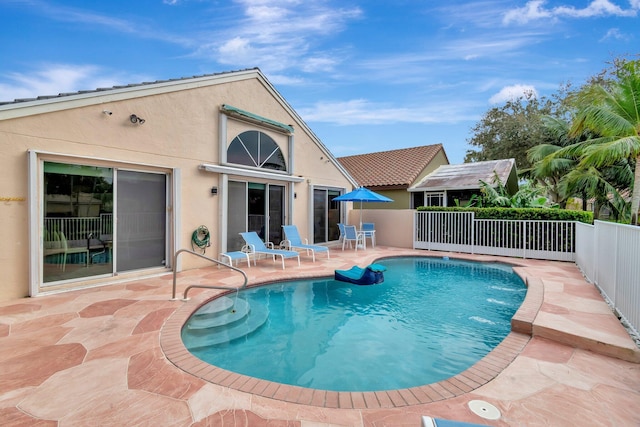 view of swimming pool featuring a patio area