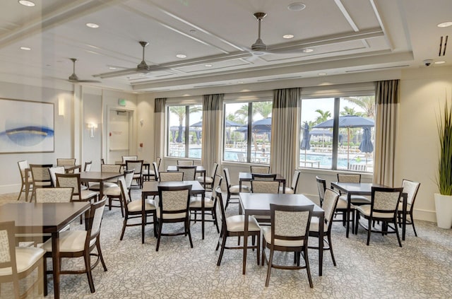 dining area with plenty of natural light, coffered ceiling, and ceiling fan